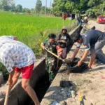 Babinsa Bersama Warga Binaan Gelar Karya Bakti Pembersihan Saluran Irigasi Demi Ketahanan Pangan